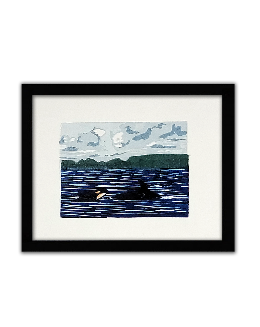 a coloured linoprint of a mother and calf orca swimming in the ocean