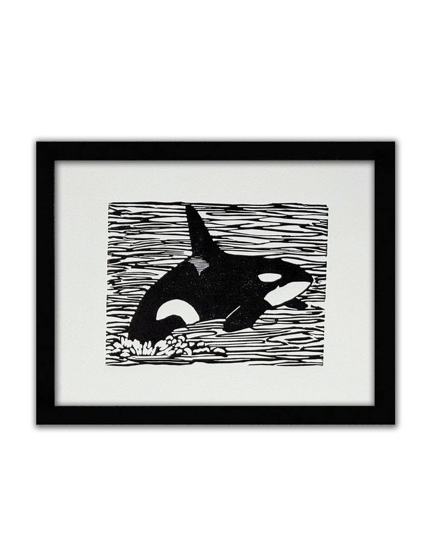 a black linoprint of an orca jumping out of the water