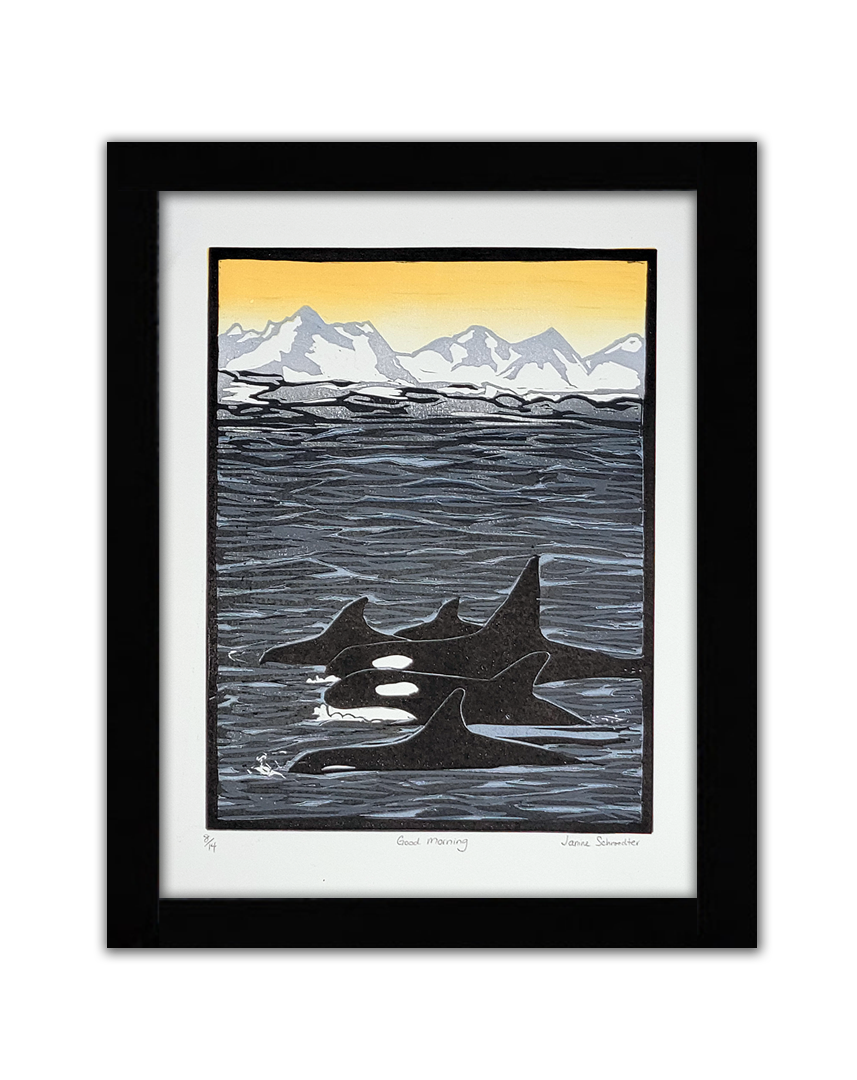 A linoprint of 5 orcas swimming. There are white mountains and a yellow sky in the background.