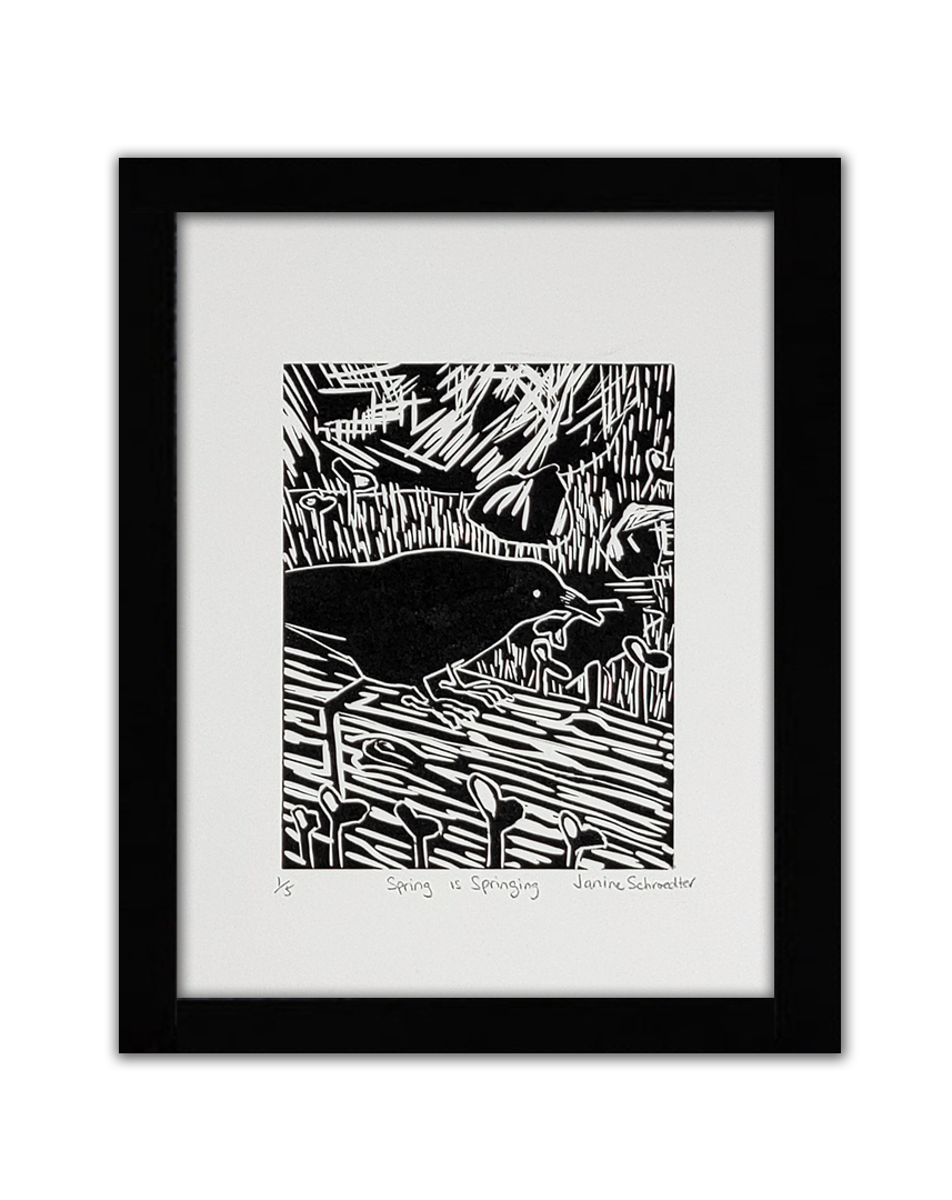 A black linocut of a bird gathering twigs outdoors in the grass