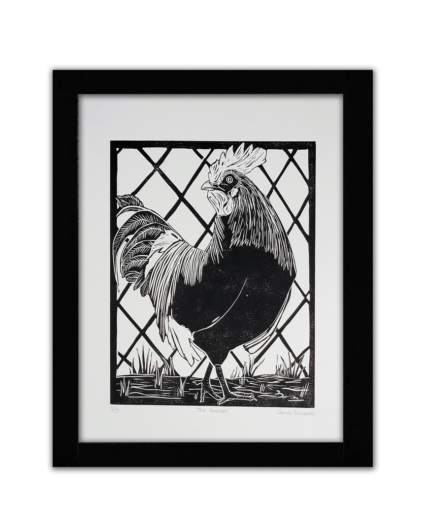 A black linocut of a rooster looking over his shoulder. He stands in grass with barbed fencing behind it